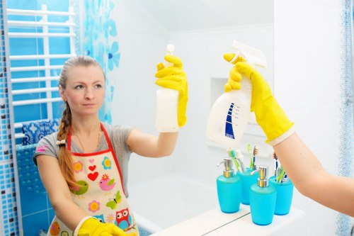 Cleaning staff following safe work procedures in a professional environment